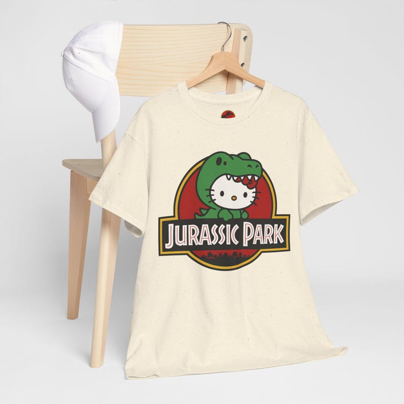 Hello Kitty Jurassic Park T-Shirt | Kawaii Dinosaur Mashup Tee | Cute Pink Graphic Shirt | Unisex Cotton Tee | Funny Movie Crossover Gift image 7