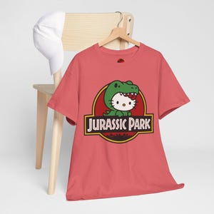 Hello Kitty Jurassic Park T-Shirt | Kawaii Dinosaur Mashup Tee | Cute Pink Graphic Shirt | Unisex Cotton Tee | Funny Movie Crossover Gift image 4
