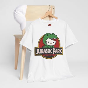 Hello Kitty Jurassic Park T-Shirt | Kawaii Dinosaur Mashup Tee | Cute Pink Graphic Shirt | Unisex Cotton Tee | Funny Movie Crossover Gift image 5