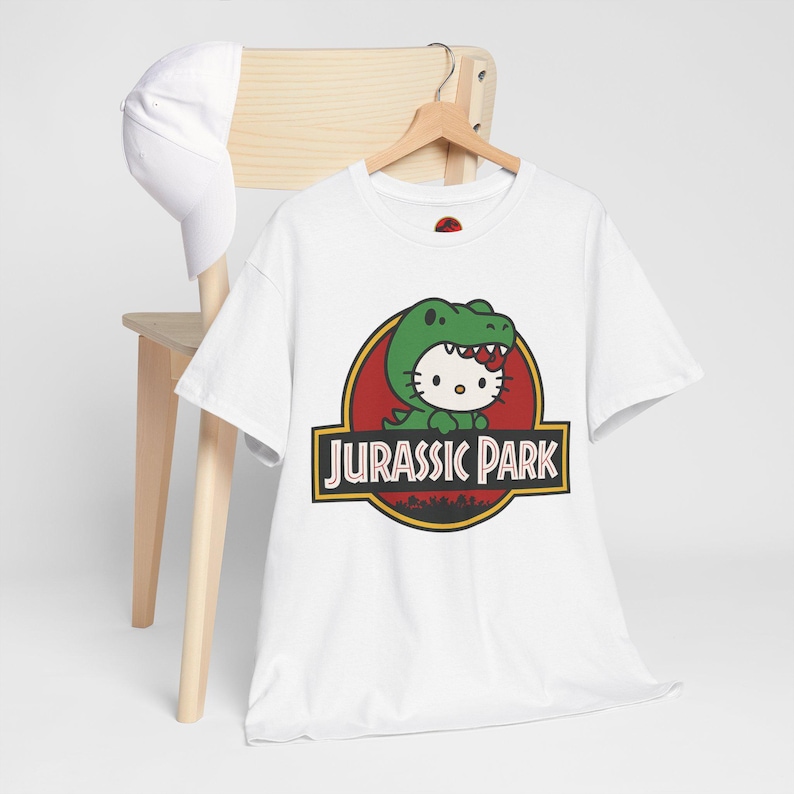 Hello Kitty Jurassic Park T-Shirt | Kawaii Dinosaur Mashup Tee | Cute Pink Graphic Shirt | Unisex Cotton Tee | Funny Movie Crossover Gift image 5