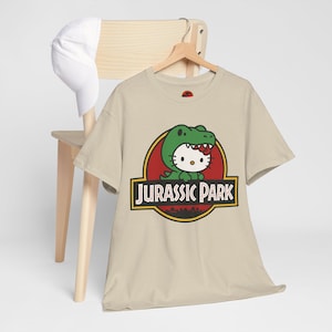 Hello Kitty Jurassic Park T-Shirt | Kawaii Dinosaur Mashup Tee | Cute Pink Graphic Shirt | Unisex Cotton Tee | Funny Movie Crossover Gift image 3