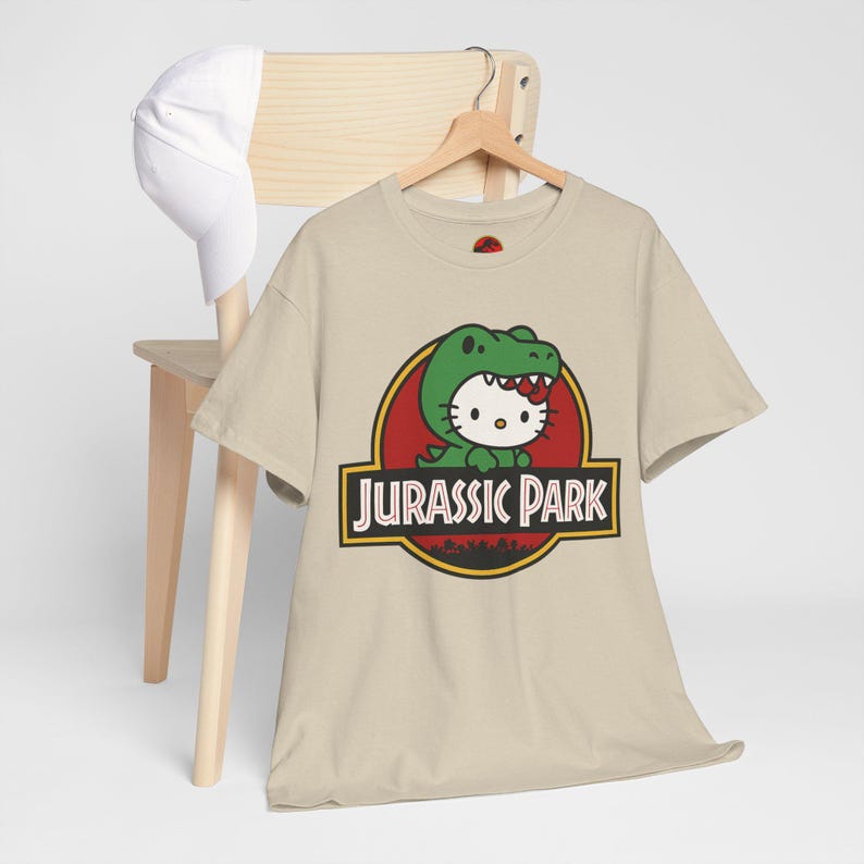 Hello Kitty Jurassic Park T-Shirt | Kawaii Dinosaur Mashup Tee | Cute Pink Graphic Shirt | Unisex Cotton Tee | Funny Movie Crossover Gift image 3