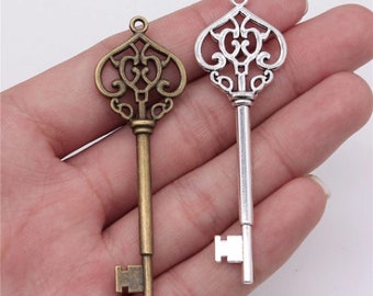 Ciondolo a forma di chiave piccola, 6x13 mm., in Argento 925 - COMPONENTI ED ATTREZZATURA | Fantasie di Perle