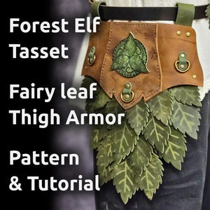 May include: Forest Elf Tasset and Fairy Leaf Thigh Armor Pattern & Tutorial. A brown leather belt with a green leaf design and a green leaf thigh armor piece.