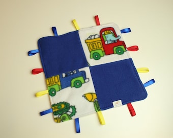 Fleece tag blanket in dark blue with squares of white with trucks, child's sensory blanket, 2 layer fleece tag toy