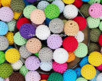 May include: A large collection of colorful crocheted balls, perfect for crafting or adding a touch of handmade charm to your home decor.