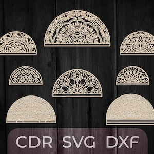 以下が含まれることがあります： クラフトプロジェクトに最適な、8つの半円形マンダラデザインのセット。デザインは木から切り取られており、複雑なパターンが特徴です。