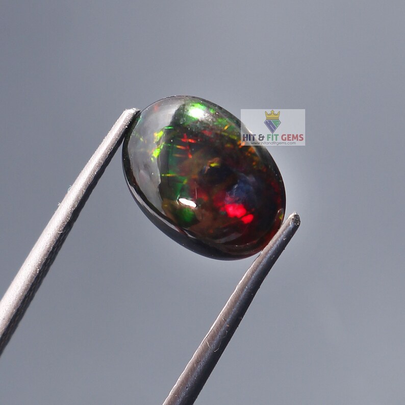 1.45Carat Black Opal Oval Cabochon 10x8mm Natural Ethiopian Welo Fire Opal Video Available