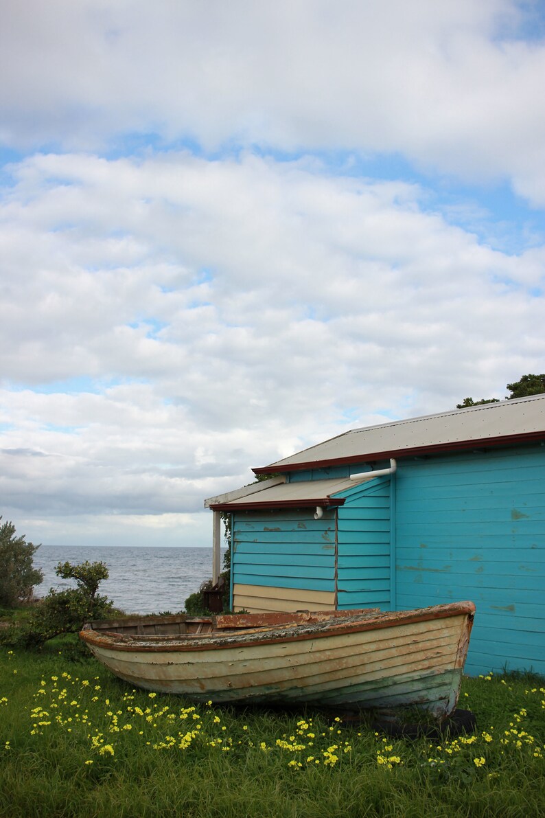 Blue boat shed beach hut with an old rustic boat at Campbells Etsy