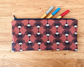 pencil case in blue and rust fabric lined with fan print