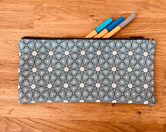 pencil case in blue fabric lined with geometric print