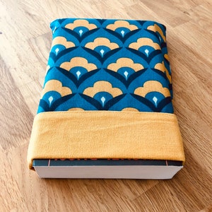 Blue and mustard yellow reversible fabric pocket book sleeve with vintage print