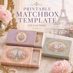 May include: Three rectangular matchbox-style gift card holders featuring ornate gold frames with floral motifs. One box is lavender with a crown, one is pink with an Eiffel Tower, and one is blue with a swan. The text reads PRINTABLE MATCHBOX TEMPLATE.