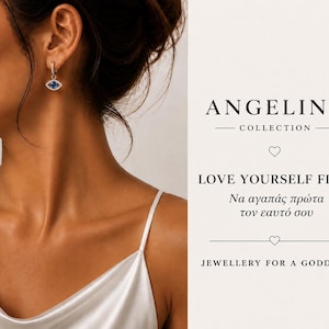 May include: A silver hoop earring featuring a blue evil eye charm with a central blue stone and surrounding clear crystals. The text reads ANGELINA COLLECTION, LOVE YOURSELF FIRST, and JEWELLERY FOR A GODDESS, along with Greek script and heart icons.