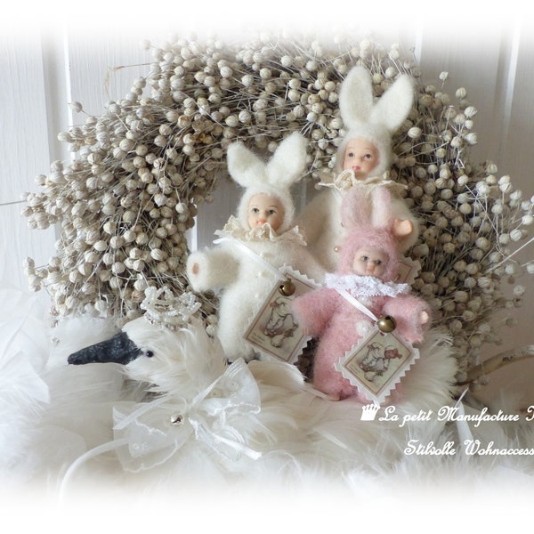 Nostalgic Pretty little old rabbit child in two different sizes in shabby chic, vintage, country house style