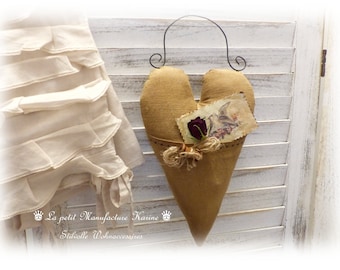 Nostalgic big heart with bag made from old flour sack in shabby chic, vintage, brocante, folk art, country house style