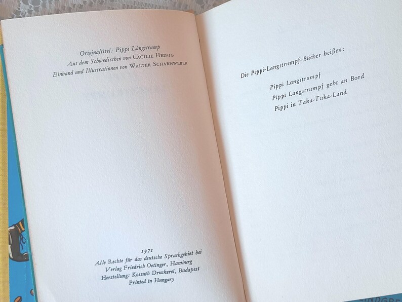 May include: Open book pages with German text. The left page includes the title "Originaltitel: Pippi Langstrump" and author information. The right page lists "Die Pippi-Langstrumpf-B&uuml;cher hei&szlig;en:" followed by book titles. The book is from 1971.