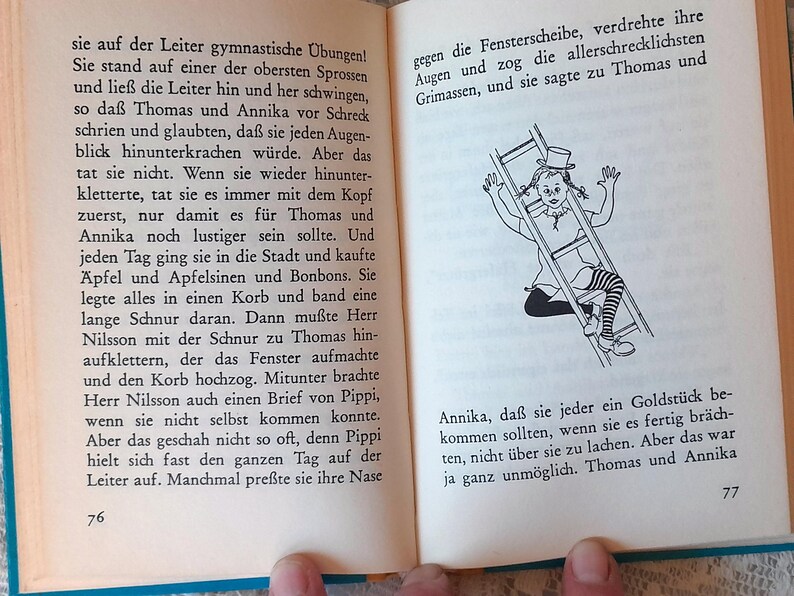 May include: Open book with German text and a black and white illustration of a girl climbing a ladder. The illustration shows the girl wearing a top hat and striped stockings. Pages are yellowed.