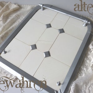 Vintage tile mirror with towel rail