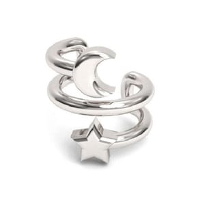 May include: Silver ear cuff with a crescent moon and a star design.