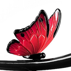 May include: A red butterfly with black markings is perched on a black branch. The butterfly's wings are spread open, showing the intricate details of its design.
