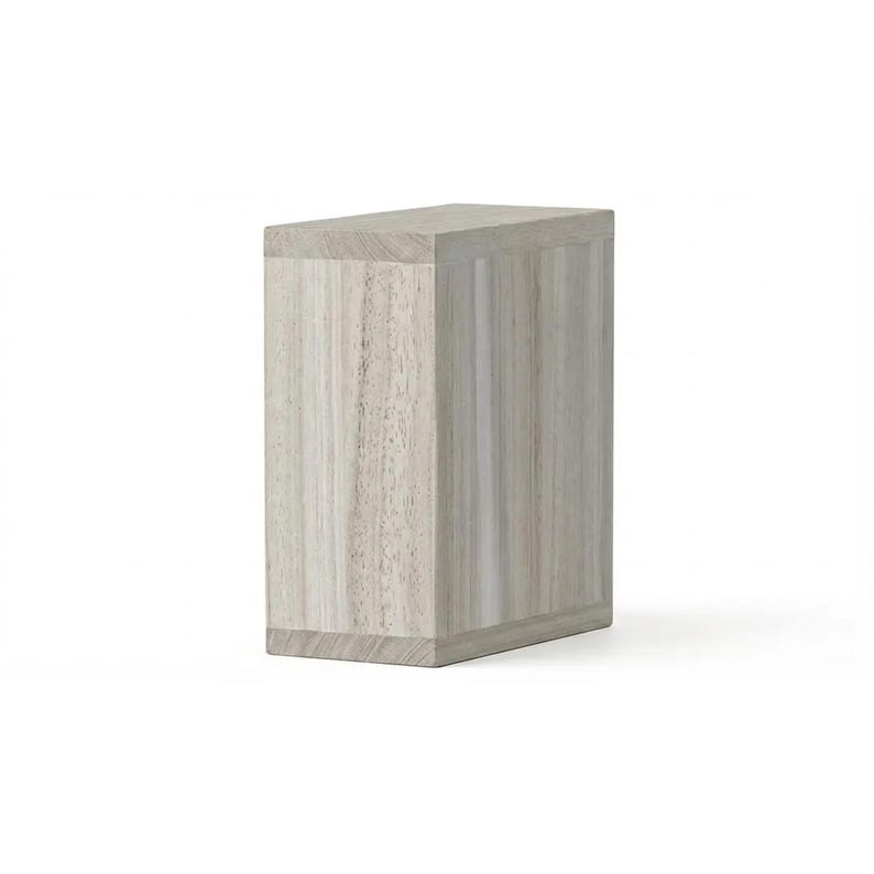 May include: A rectangular wooden box with a light gray and beige wood grain pattern. The box has a simple, modern design with clean lines and a slightly textured surface. The top and bottom edges are slightly beveled.