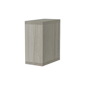 May include: A rectangular wooden cabinet with a light gray wood grain finish. The cabinet is a tall, narrow design, with a flat top and base. The wood grain runs vertically, adding texture to the piece. The cabinet is a neutral color, suitable for various decor styles.