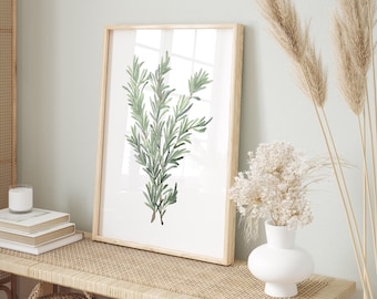 May include: A framed watercolour painting of a sprig of rosemary with green leaves on a white background. The frame is light wood and the painting is hanging on a light green wall.
