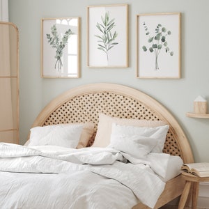 Watercolor minimalist greenery set depicting eucalyptus and olive branch, bedroom wall decor over a queen size bed.