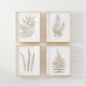 Pu&ograve; includere: Quattro stampe botaniche incorniciate con illustrazioni di felci ad acquerello nei toni del beige e del marrone. Le stampe sono presentate in cornici di legno chiaro, creando un'estetica naturale. L'opera d'arte &egrave; ideale per aggiungere un tocco di natura a qualsiasi spazio.