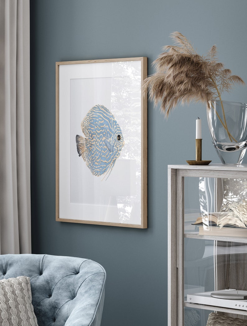 Single watercolor discus fish hang in a modern Hamptons living room.