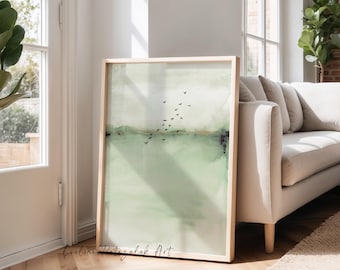 May include: A framed abstract art print with a light wood frame. The artwork features a soft green and white watercolor landscape with a flock of black birds in flight. The artist's signature, "Eveline Patrzalek Art," is visible in the lower left corner.