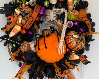 Halloween wreath, skeleton wreath, Halloween, Skeleton, pumpkins, faux candy apples, trick or treat