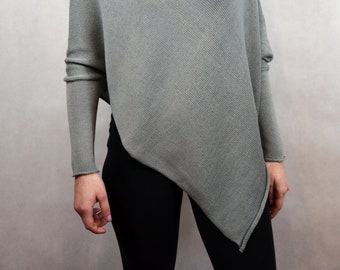 Knitted poncho-sweater with a loose cut