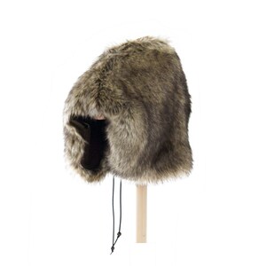 May include: A brown faux fur hat with a long, black drawstring. The hat has a wide brim and a pointed top.