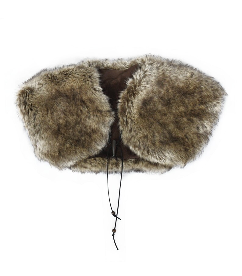 May include: A brown faux fur collar with a suede backing and a black leather tie closure.