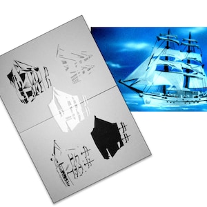 May include: A sheet of paper with four different stencils of ships. The stencils are in black and white. The paper is folded in half. The background is a blue sky with white clouds. The image shows a ship with white sails and a blue hull.