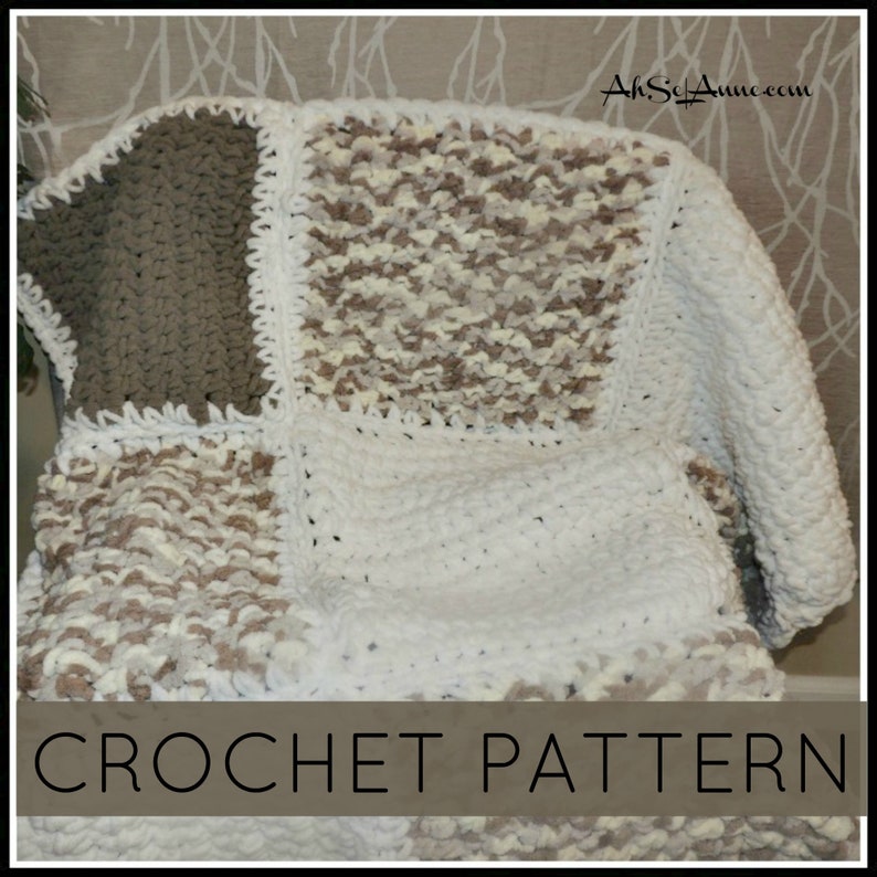 May include: A crochet blanket with a patchwork design in white, brown, and beige. The blanket is made with a chunky yarn and has a crocheted border. The text "CROCHET PATTERN" is at the bottom of the image.
