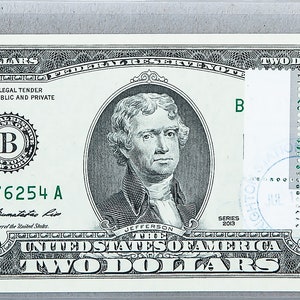 Banconota da 2 dollari *Banconota da due dollari *Federal Reserve Bank *Moneta preziosa non circolata *Valuta cartacea *Bandiera nazionale Collezione di francobolli Guinea-Bissau