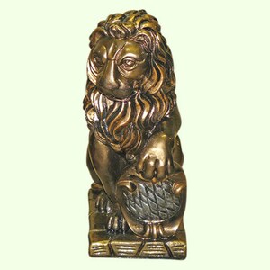 May include: A bronze-colored lion statue with a detailed mane and a shield. The lion is seated and holds a shield with a textured pattern. The statue has a weathered appearance, suggesting an antique or vintage style.