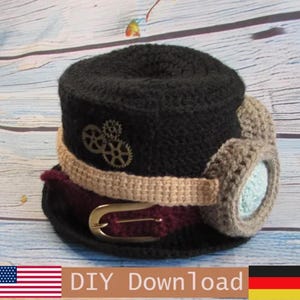 May include: A black crocheted top hat featuring a tan band, a dark red belt with a gold-toned buckle, and a pair of light brown crocheted goggles with light blue lenses. The side of the hat is decorated with two small metallic gear-shaped embellishments.