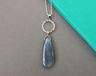 Sterling silver and kyanite necklace | Handmade twisted textured silver circle and large blue gemstone drop pendant on an 18 inch chain