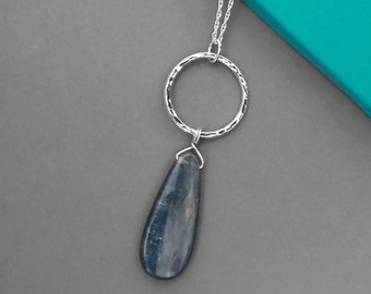 Sterling silver and kyanite necklace | Handmade hammered silver hoop and large blue teardrop gemstone pendant on an 18 inch chain