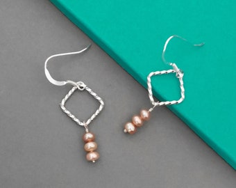 Sterling silver and pearl earrings | Handmade twisted silver squares and dyed light pink freshwater cultured pearl dangle earrings for women