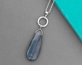 Sterling silver and kyanite necklace | Handmade hammer textured circle and large blue teardrop gemstone pendant on an 18 inch chain