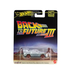 May include: A Hot Wheels die-cast model of the DeLorean time machine from Back to the Future III. The silver car with brown wheels is displayed on a black and orange card, featuring the film's title and "Pop Culture" branding.