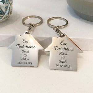 Personalised Our First Home or Our New Home Keyrings in beautiful high gloss stainless steel.. sold as a pair or as a single keyring