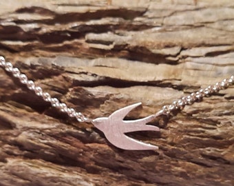 Stud earrings, swallow in 925/- sterling silver, 1 pair of swallows and matching delicate chain with small swallow in the middle in 925/- sterling silver