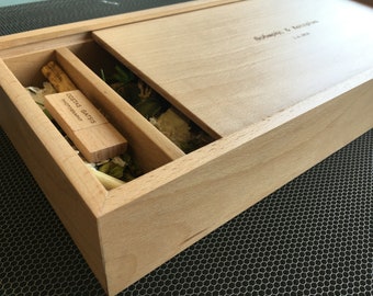 May include: A wooden box with a sliding lid, containing a wooden USB drive with the text "Costas Gatiss Photography" engraved on it. The lid of the box has the text "Antonis & Melissa" engraved on it.