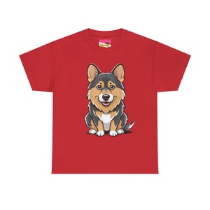 May include: Red t-shirt featuring a cartoon corgi. The corgi is predominantly black and tan, sitting and facing forward. The shirt is a classic crew neck style, short-sleeved, and made of a soft cotton material.  The design is centered on the shirt. This apparel item is perfect for dog lovers and fans of the corgi breed.